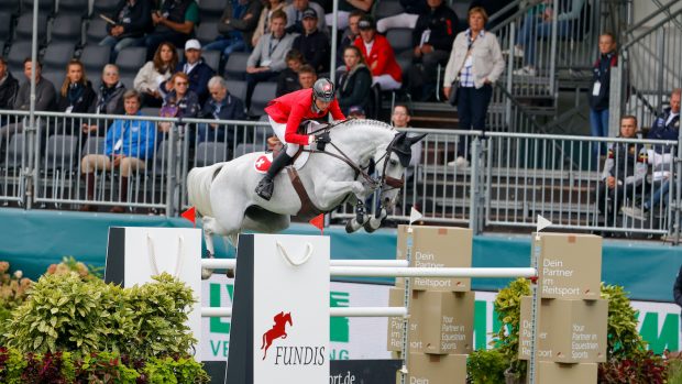 Martin Fuchs riding Leonie Jei in the European Showjumping Championships first round competition.
