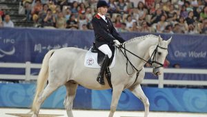 Lambrusco, pictured at the 2008 Paralympic Games with Sophie Christiansen, has died aged 28