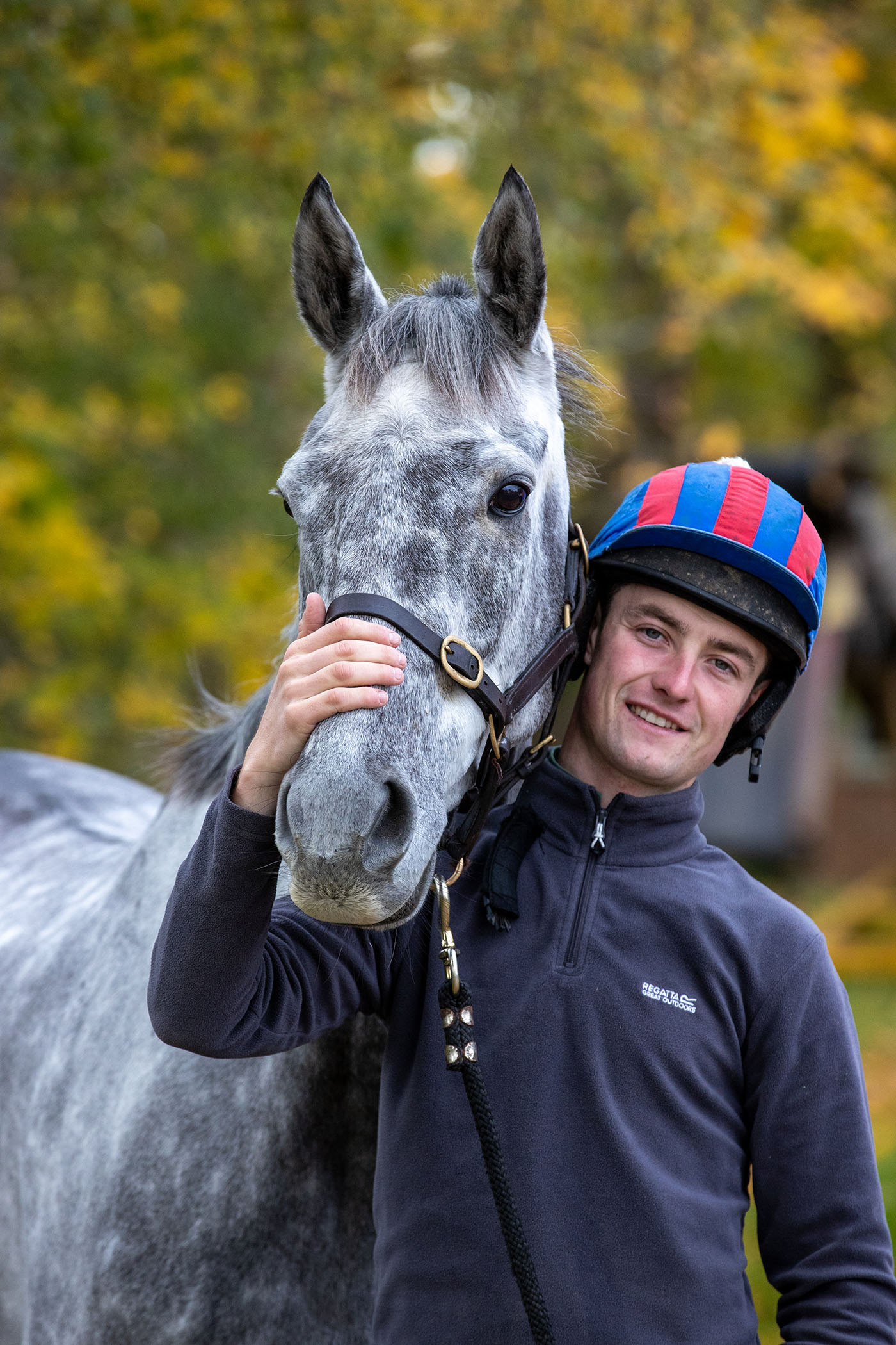 Jockey James King with horses at yard. Stratford upon avon.