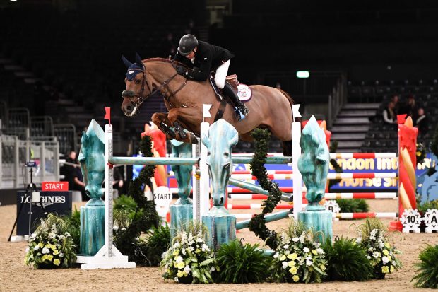 John Whitaker and Green Grass winning the two-phase at London Horse Show