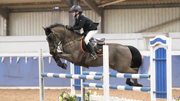 Georgia Hogan jumping the 128cm bronze league with her 20-year-old mare Darth Moll
