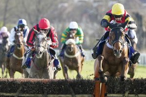 Paddy Brennan riding Knight Salute clear the last to win The Coral Adonis Juvenile Hurdle at Kempton Park in the build up to the Cheltenham Festival