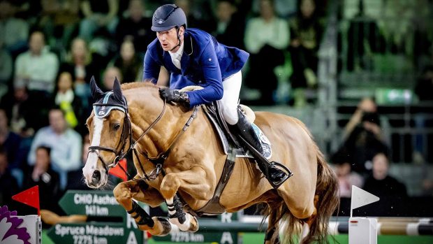 Germany's Daniel Deusser competes to win the Jump-Off on Tobago Z during the Rolex Grand Slam Grand Prix