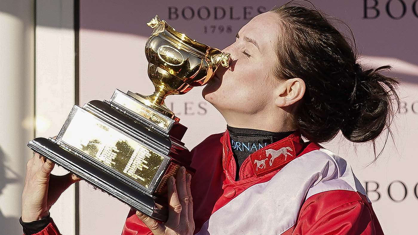 CHELTENHAM, ENGLAND - MARCH 18: Rachael Blackmore kisses the Gold Cup after riding A Plus Tard to win The Boodles Cheltenham Gold Cup Chase on day four of The Festival at Cheltenham Racecourse on March 18, 2022 in Cheltenham, England. (Photo by Alan Crowhurst/Getty Images)