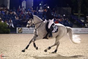 Laura Kraut on Confu celebrates her four-star grand priz win at the Winter Equestrian Festival