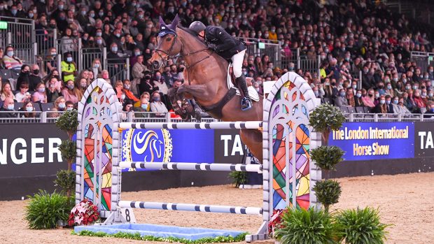 John Whitaker GBR riding Unick du Francport during The Santa Stakes (Class 03) at The London International Horse Show at the ExCel London in the UK, on the 16th December 2021