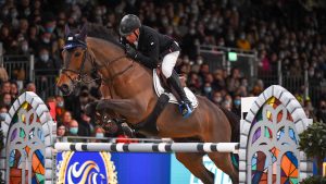 John Whitaker riding Unick du Francport during the London International Horse Show