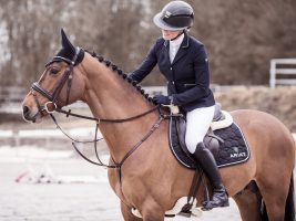 Riding wearing Ariat riding boots