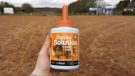 NAF Profeet Farrier Solution bottle in hand