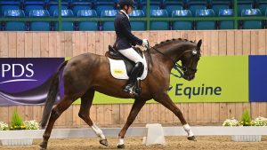 Jo Barry claims fifth riding Headmore Bella Luce in the novice freestyle gold at the winter dressage championships