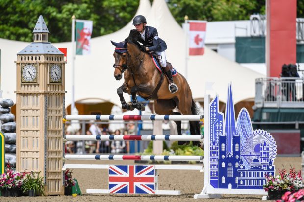 Joe Stockdale and Equine America Cacharel jumping at Royal Windsor Horse Show