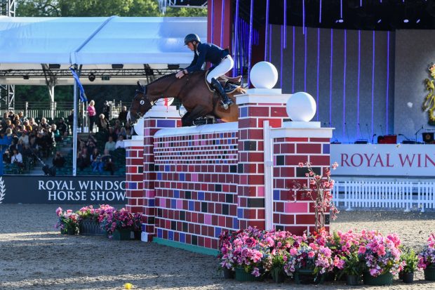 Trevor Breen and Chankar Mai winning the puissance at Royal Windsor Horse Show