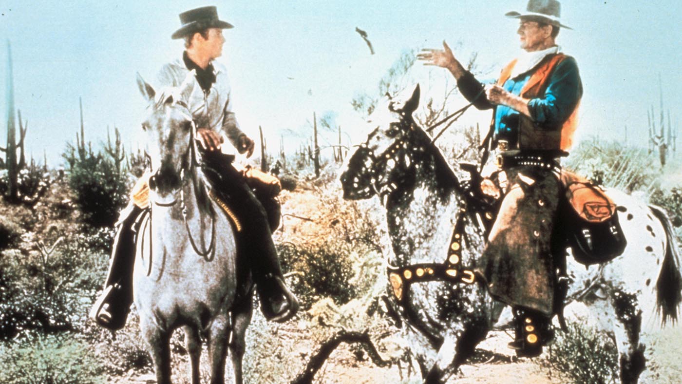 John Wayne rides an appaloosa in the film El Dorado in 1966