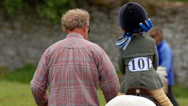 Father and daughter at a horse show