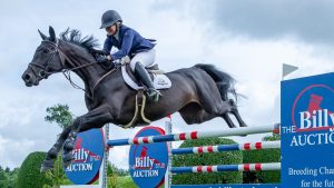 Nicole Pavitt and Colliers Carlotta jump the Billy Stud Auction fence on the way to a win in the six-year-old championship at Hickstead 2022