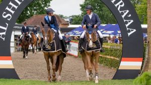 William Funnell and Harriet Biddick leave the ring after sharing the win in the Hickstead derby trial 2022