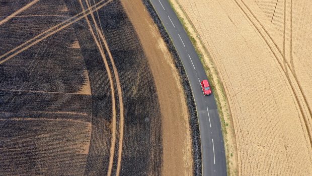 Heatwave fires: ROTHERHAM, UNITED KINGDOM - JULY 20: An aerial view of charred fields after a crop fire yesterday near the village of Dinnington on July 20, 2022 in Rotherham, United Kingdom. A series of fires broke out across England yesterday as the UK experienced a record-breaking heatwave. Temperatures in many places reached 40c and over. (Photo by Christopher Furlong/Getty Images)