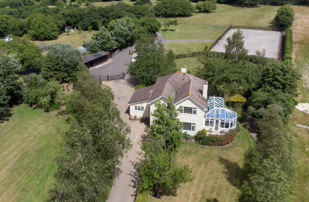 A beautiful horsey setup with stables, grazing, arena and a five