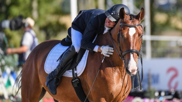 Latvia’s Rihards Snikus and King Of The Dance score a whopping 80.4% to head the grade I team test in the World Para Dressage Championships