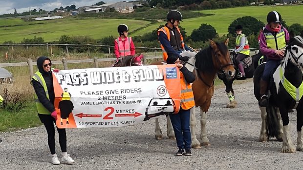 Equestrians took to the roads to help raise awareness to drivers of how to pass horses on the road safely