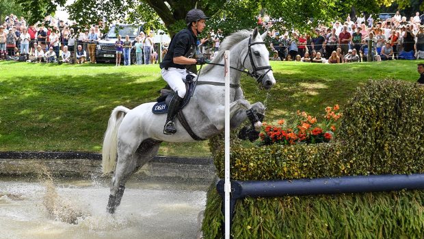 Burghley Horse Trials tickets Richard Jones and Alfies Clover clear the brush corner in the Trout Hatchery at Burghley Horse Trials 2022