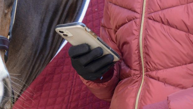 Rider using phone with gloves on