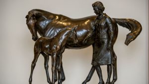 The bronze maquette of the iconic statue that is a landmark in Newmarket, showing The late Queen with a mare and foal