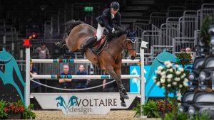 Harry Charles riding Chavira during the Voltaire Design under 25 British Championship at London Horse Show