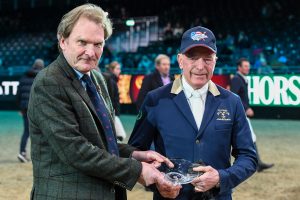 John WHITAKER being presented with the British Equestrian Writers Association (BEWA) their Life Time Achievement Award by Rupert Bell (Chairman) during The London International Horse Show at ExCel in London on the 17 December 2022