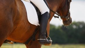 Horse rider wearing spurs