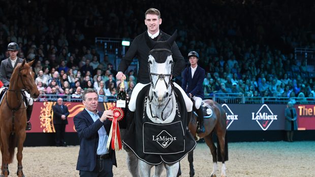 Joe Trunkfield after winning the Lemieux Six Bar at the 2022 London International Horse Show riding Cruze.
