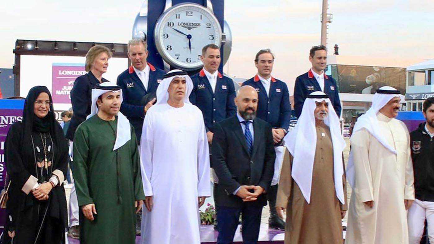 Joe Whitaker, Donald Whitaker, William Funnell, Tim Gredley and Di Lampard are on the podium after the Nations Cup in Abu Dhabi, UAE