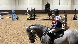 Geoff Billington watches Oliver Townend jump during For One Night Only lecture demo at Addington