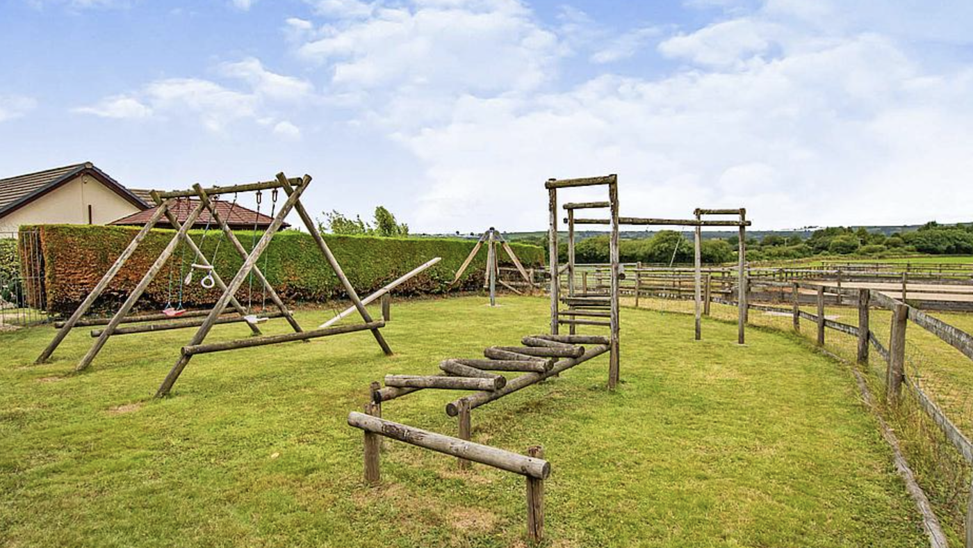 Children's playground in garden at Hunters Lodge, Carmarthenshire