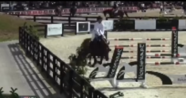 Lauren Hough suffers a tack malfunction at the Winter Equestrian Festival (WEF)