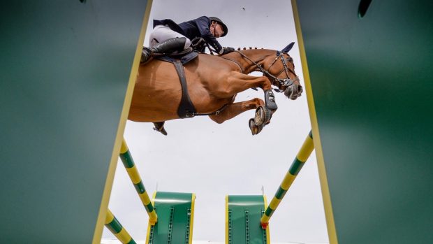 Ben Maher and Explosion jump the Rolex oxer in the Royal Windsor grand prix