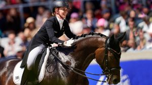 Jessica von Bredow-Werndl rides the grand prix special wearing an earpiece at CHIO Aachen 2023