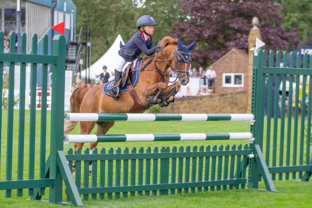 Annabel Widdowson riding Bunbury Conquest to win the Pro Ponies BS 128cm winter championship at the Royal International Horse Show 2023