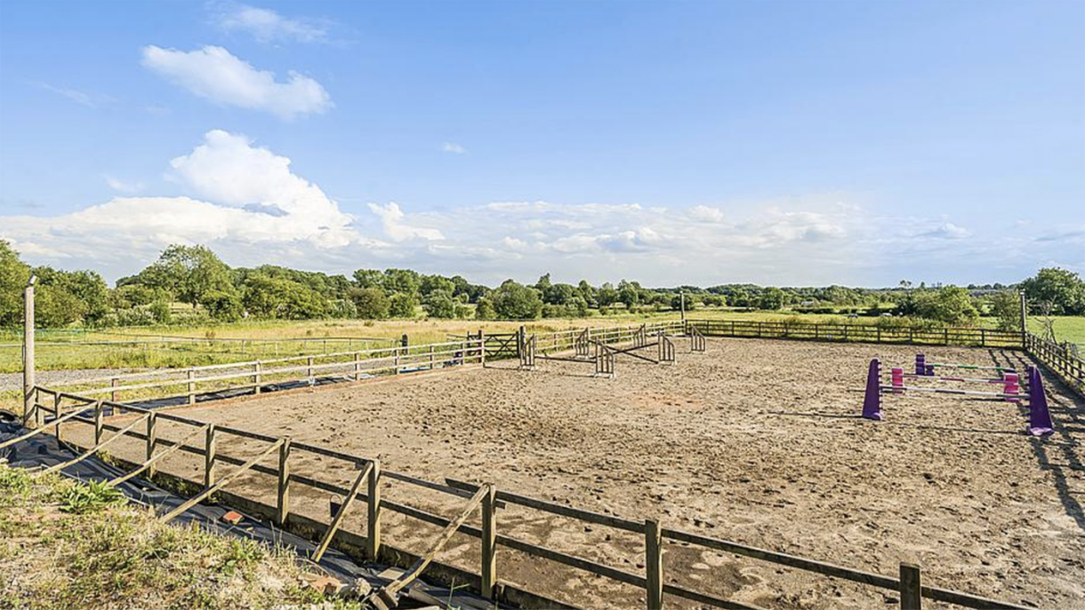 A farmhouse with six stables, arena, paddocks and more in a very ...