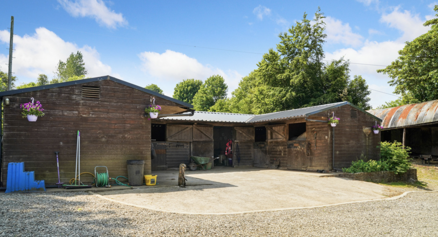 A four-bedroom farmhouse with 5 stables, area, health club, sauna and virtually seven acres for only £800,000