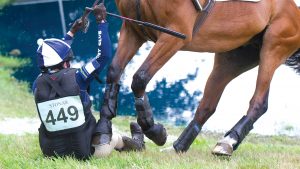 A rider wearing an inflated air jacket after a fall on cross-country