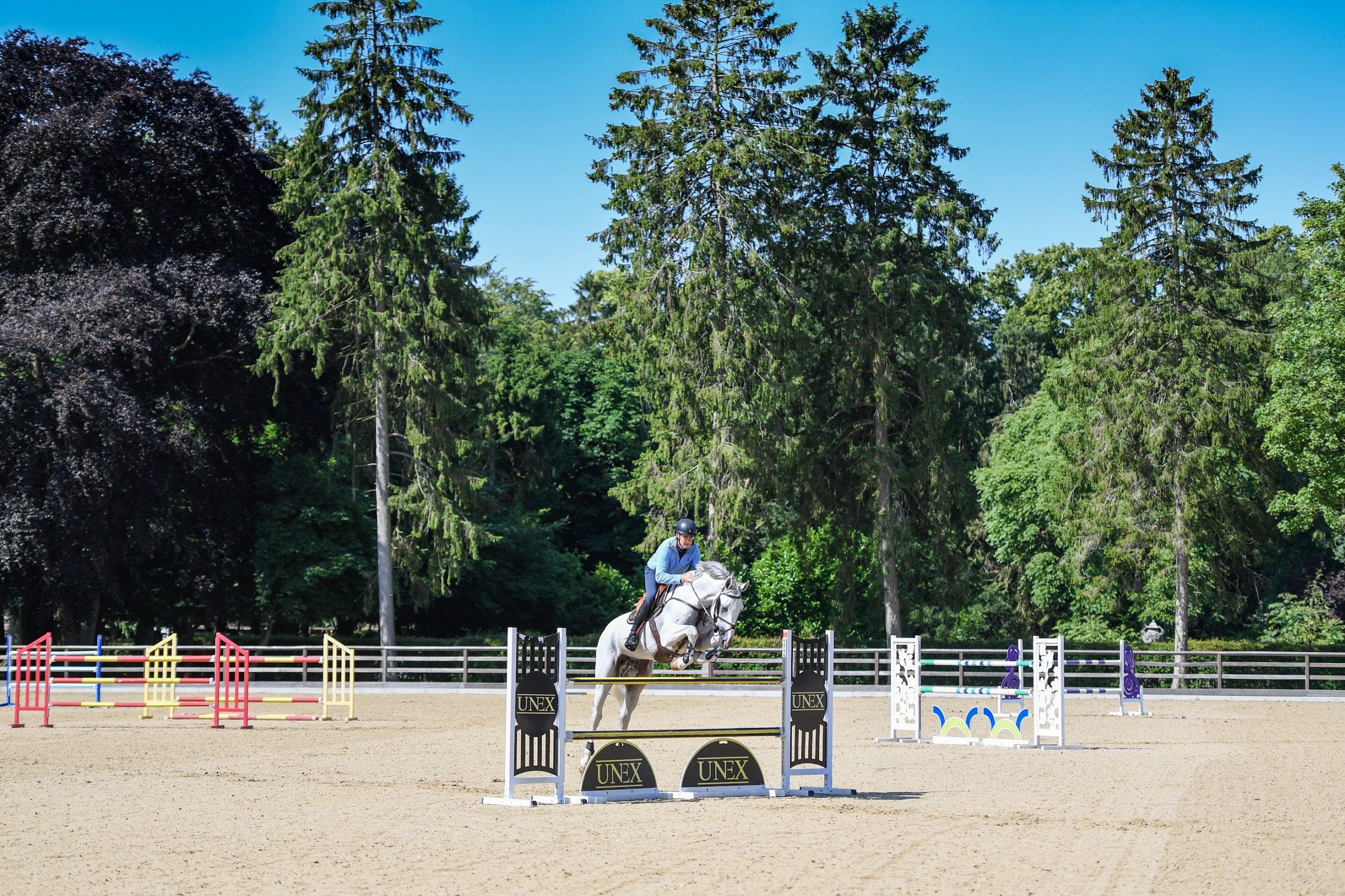 What a backdrop! The peaceful Suffolk countryside surrounds Tim's stables, which includes this huge outdoor arena.