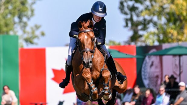 Olympic showjumper Katie Laurie, pictured with Cera Caruso, completed the Suncor Winning Round at the Spruce Meadows Masters with just one stirrup