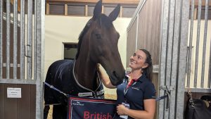 Lucy Scudamore, groom to Carl Hester, with Fame at the European Dressage Championships 2023