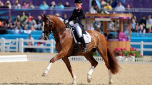 G5BJHC Great Britain's Laura Bechtolsheimer riding Mistral Hojris compete during the Team and Individual Dressage Grand Prix at Greenwich Park, on the sixth day of the London 2012 Olympics.