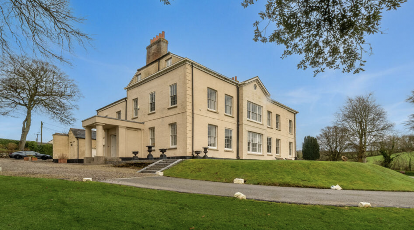 Take a look at this eight-bedroom manor with pool, 12 acres and extra, only one mile from seashores