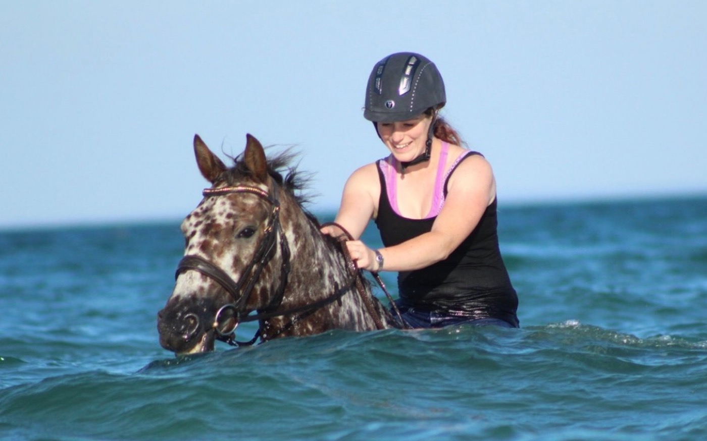 Whitehawk Dancing Fire swimming in sea