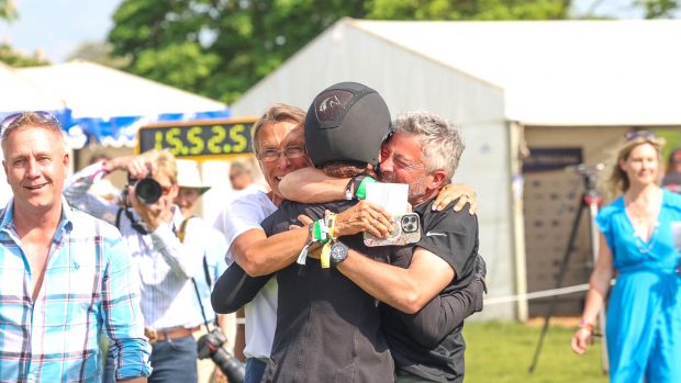 Chris Mann, owner of Greenacres Special Cavalier embraces Caroline Powell after she won Badminton Horse Trials 2024