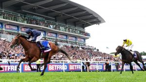 City of Troy gallops in front of the stands at Epsom on his way to coming first in the 2024 Epsom Derby results