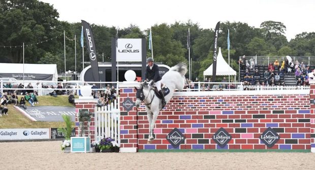 Guy Williams and Mr Blue Sky UK clear the puissance wall at Bolesworth